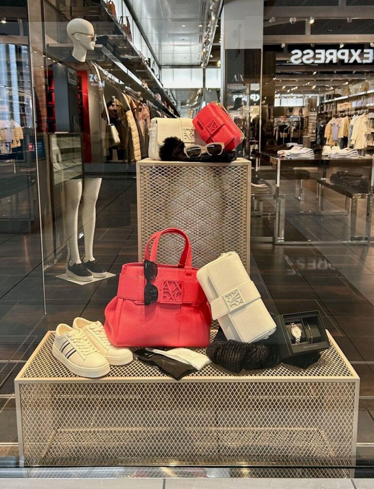 Window riser with red handbag and accessories
